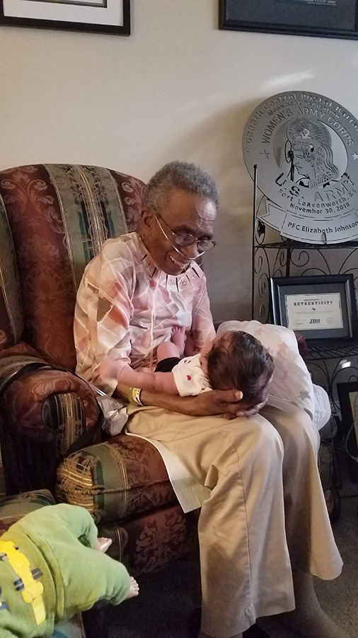 Elizabeth holding baby